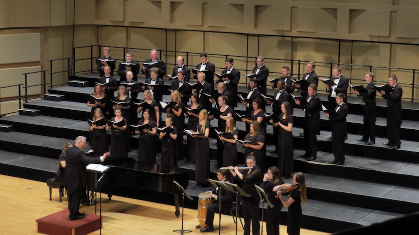 Photo of choral singers on stage. 