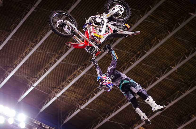 Photo of a James Carter doing an aerial flip on his motorcycle. 