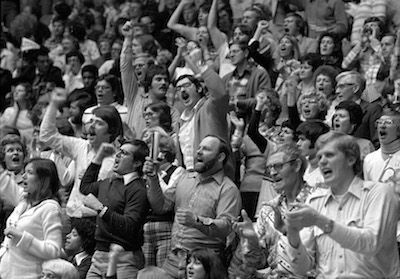 Spectators cheer during the 1977 game.