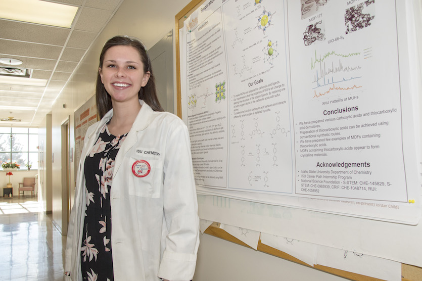 Emily Morley standing by research poster