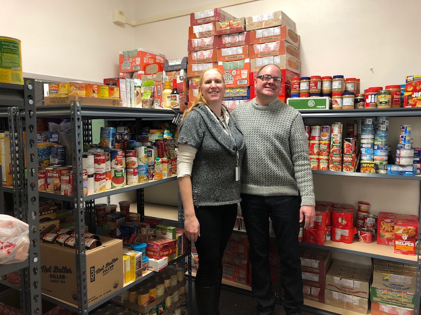 Two people in Hawthorne Middle School food pantry.