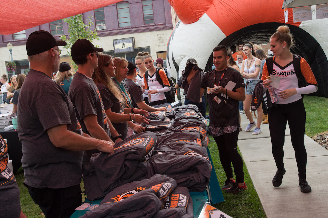 Students getting T-shirts at 2018 Welcome Back Orange and Black