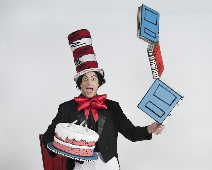 Photo of Cat in the Hat with a cake and book props.