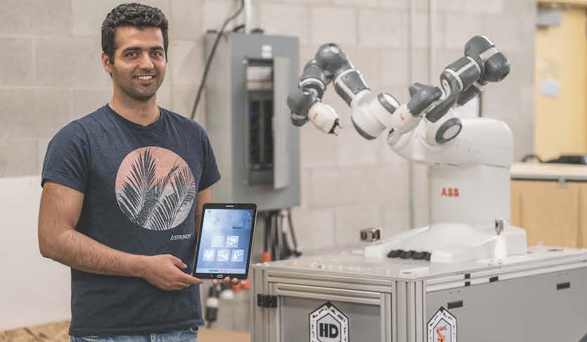 ISU Ph.D. student Omid Heidari poses with the type of robot that will be used in the IGEM project.