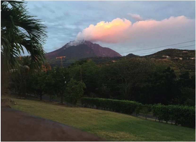 Photo of a volcano with smoke coming out that is on the tiny Caribbean island of Montserrat.