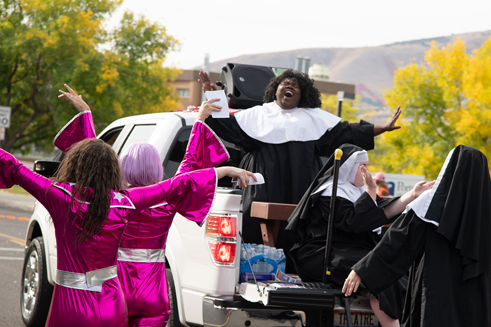 Theater student performing Sister Act on a float