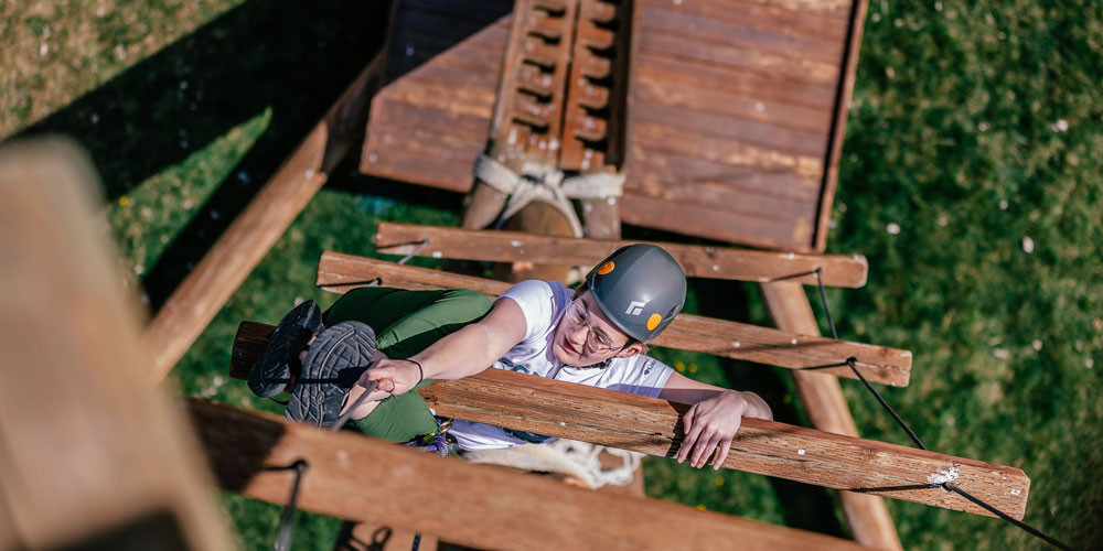 Students climb the Alpine Tower Challenge Course on Idaho State University’s Pocatello Campus.