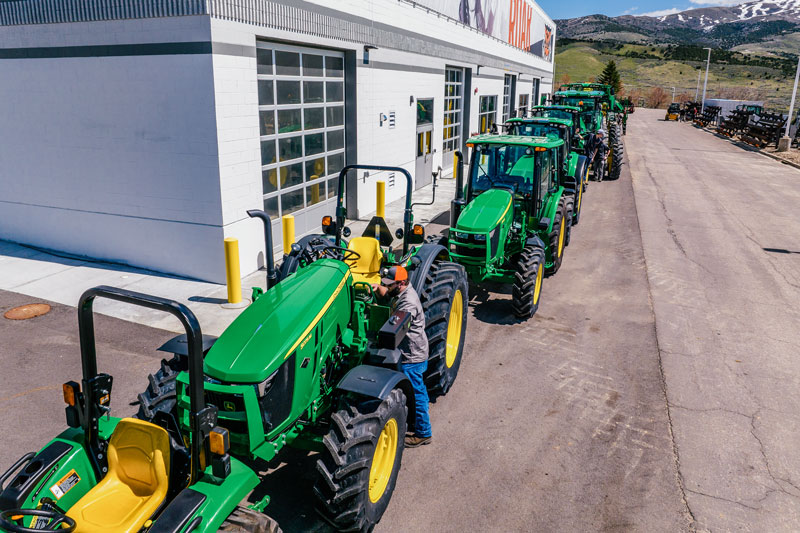 John Deere tractors leased to ISU by Stoltz Equipment are lined up outside the Eames Complex