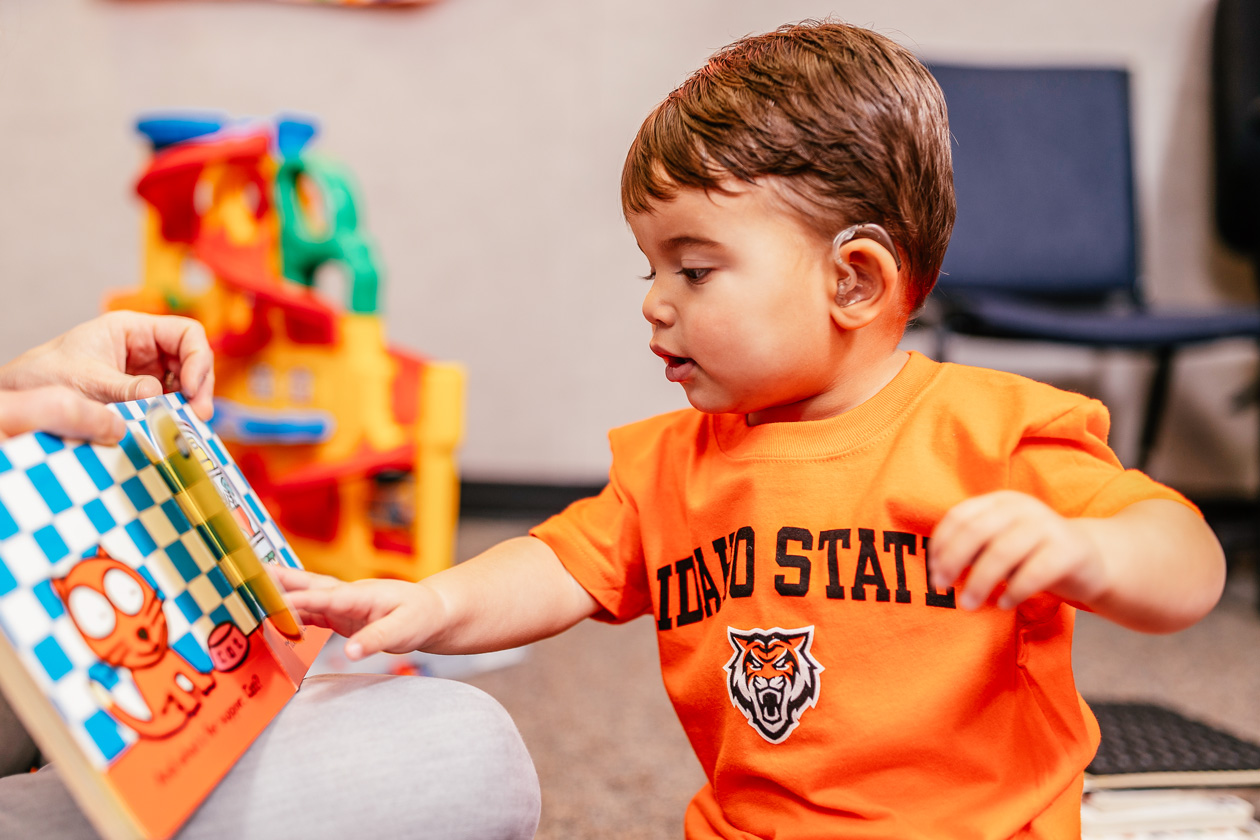 Ethan Estevez goes through a flip-book at Idaho State University’s Speech Language Pathology and Audiology Clinic.