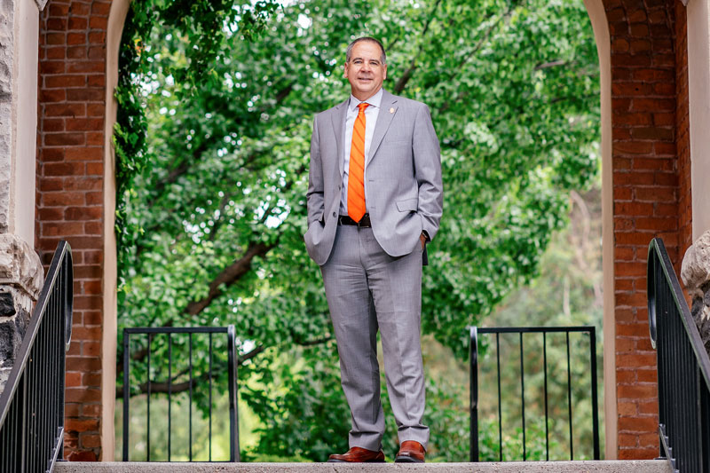 ISU President Wagner standing under the Swanson Arch