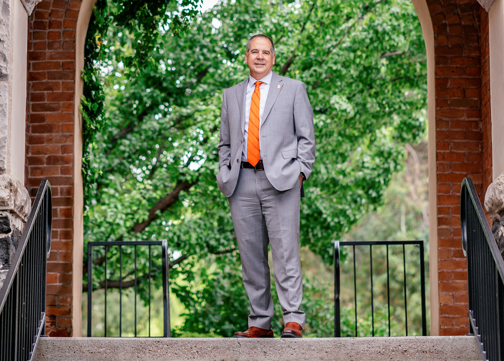 ISU President Wagner standing under the Swanson Arch