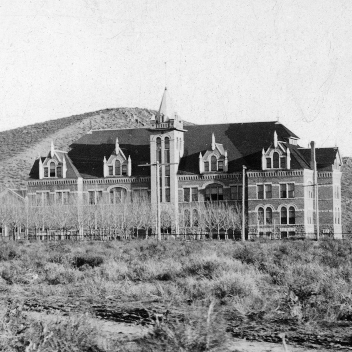 A black and white historical photo of Swanson Hall