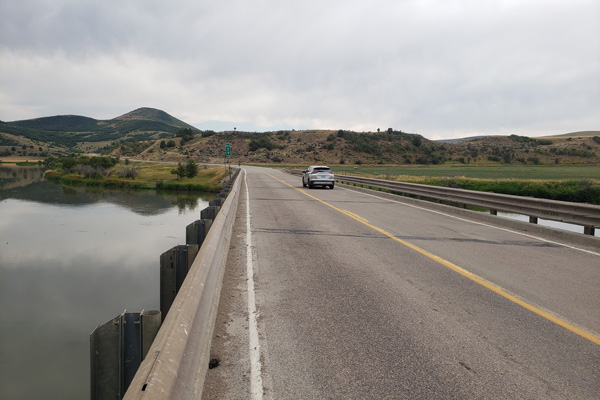 A car driving over a bridge