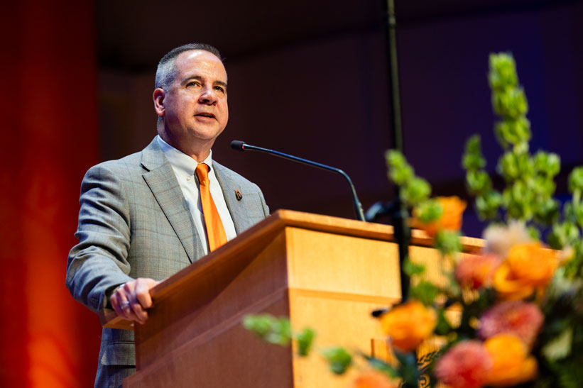 President Wagner speaking behind a podium at his Inaugural Address