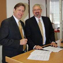 ISU Provost Olson, left, and CSI Executive Vice President Fox signing MOA.