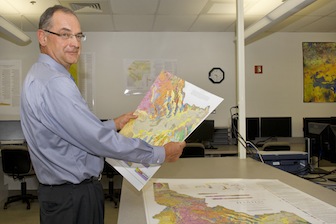 ISU Geosciences Professor Paul Link, with new map. (ISU Photographic Services)